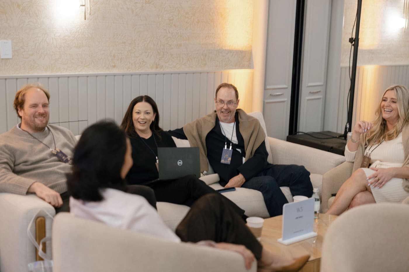 Team members talking on a sofa