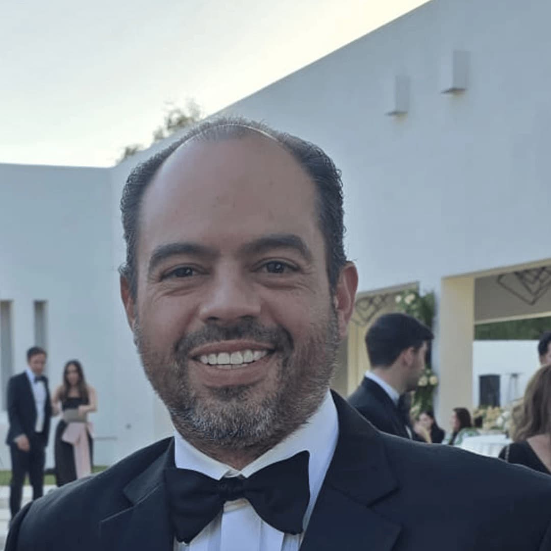 Portrait of Carlos Alvarez in a dinner jacket at an outdoor event